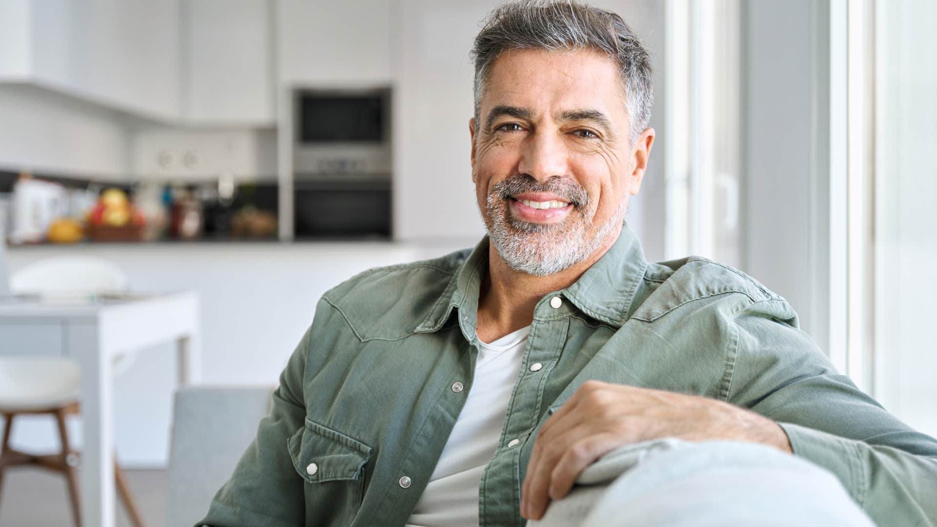 Relatively private man sitting at home alone.