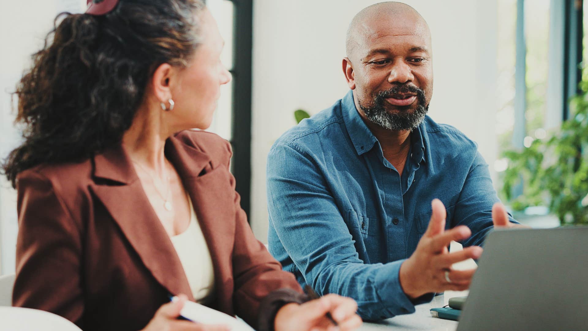 man giving constructive criticism to colleague