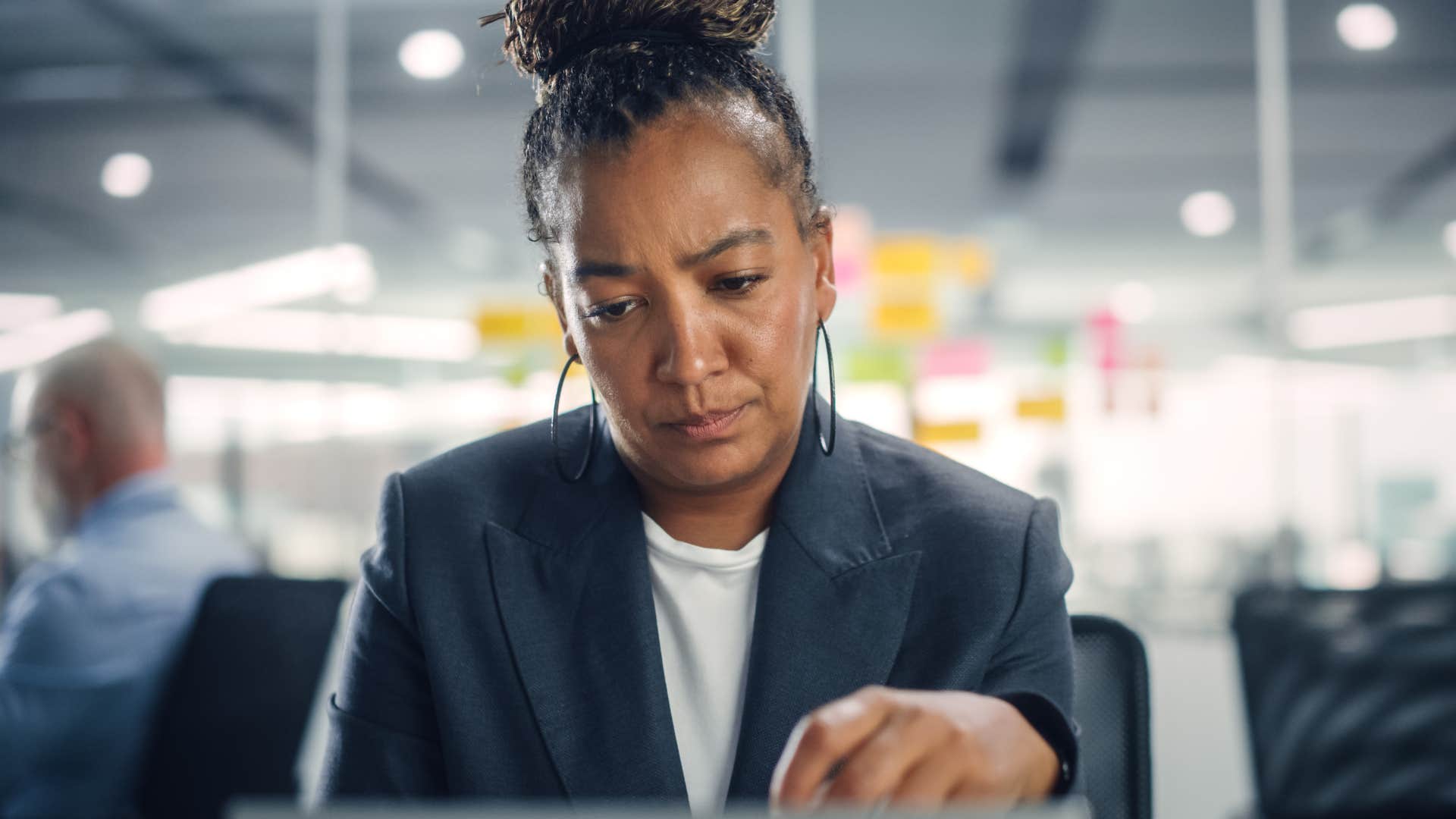 woman feeling pressured to overwork herself in a job