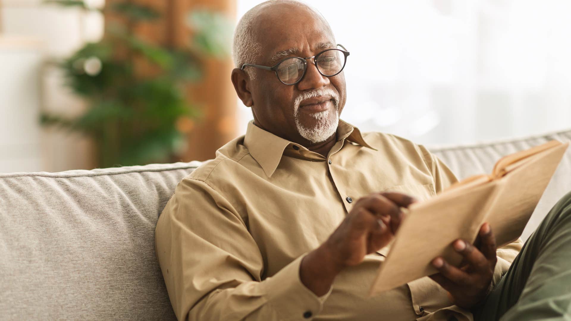 man doing research without screens or AI at home