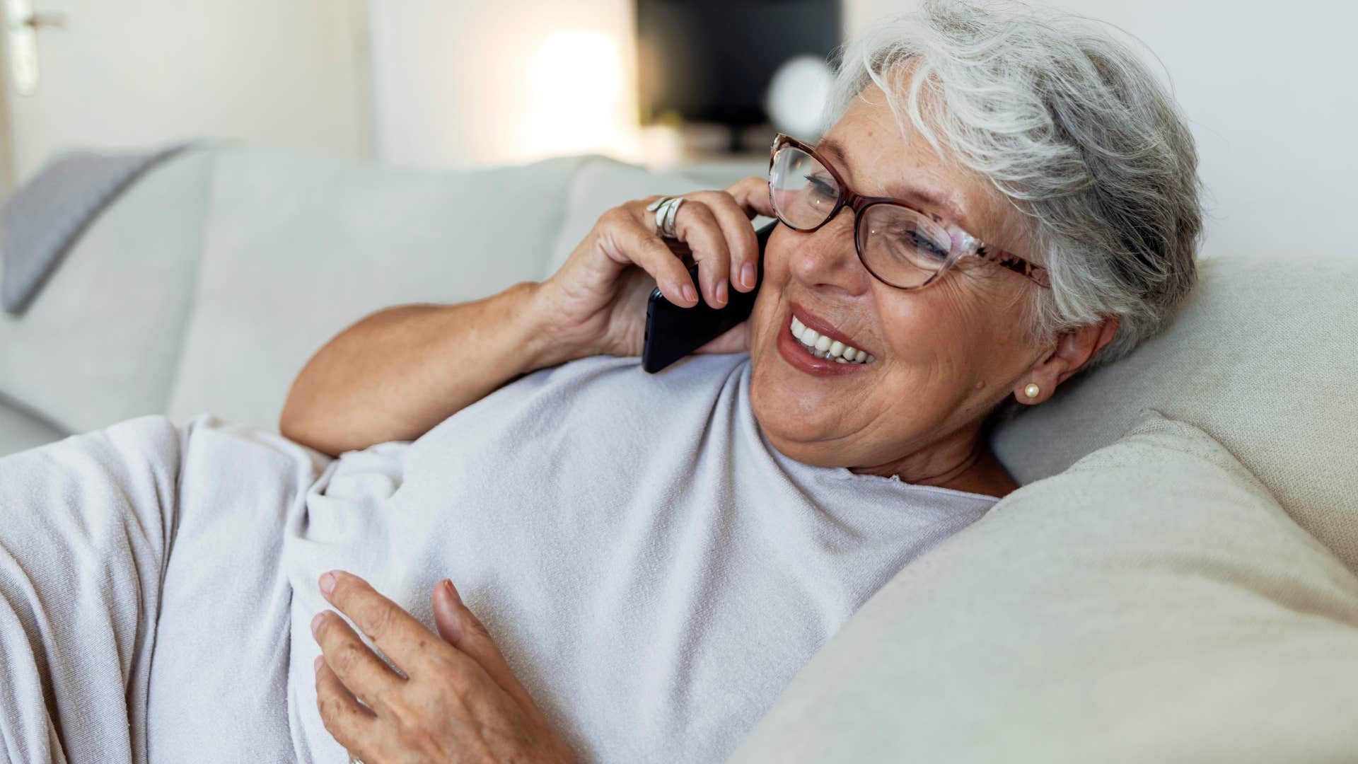 woman born in the 1960s on the phone getting unexpected phone call