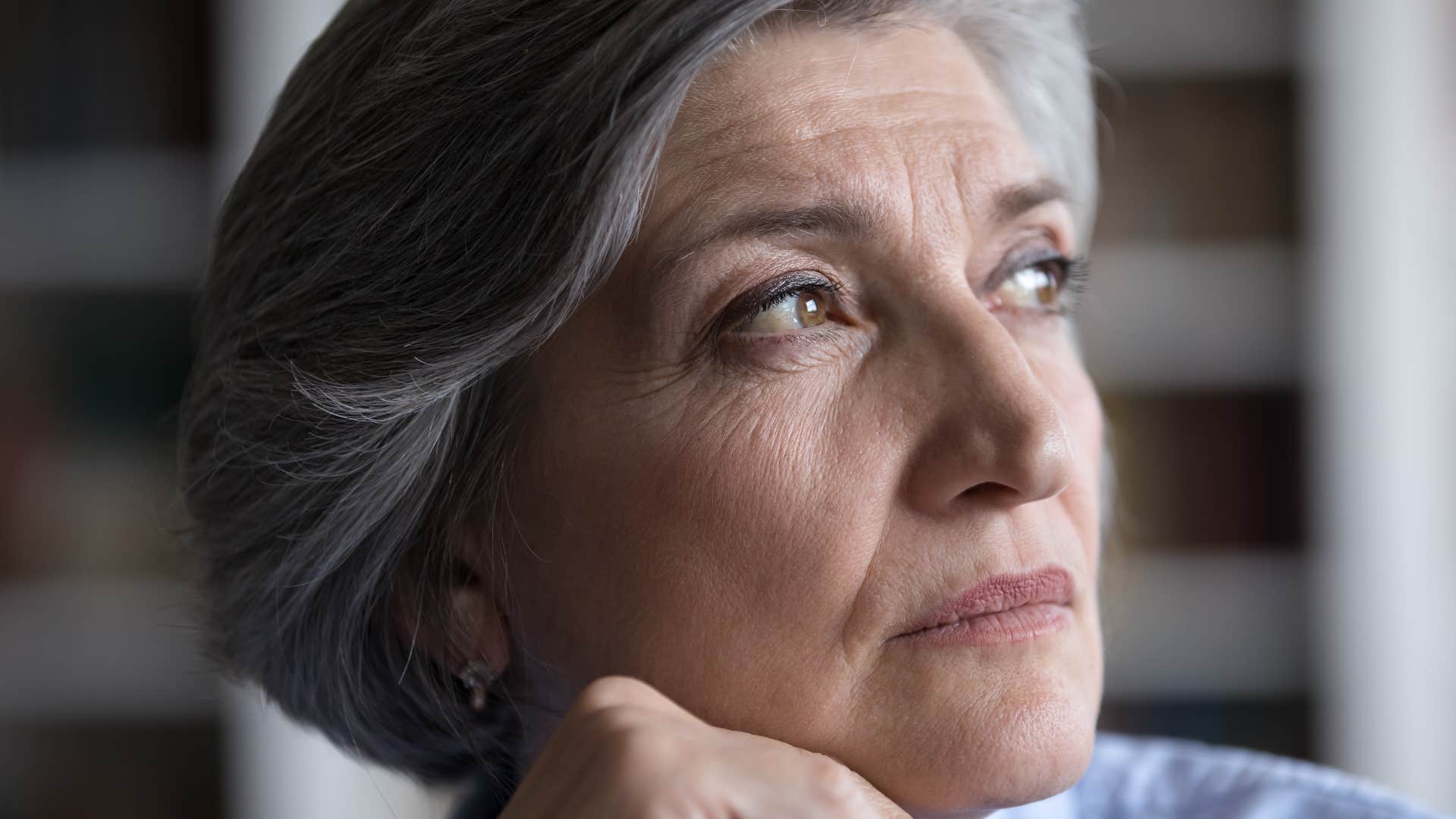 pensive woman born in the 1960s practicing waiting and delayed gratification
