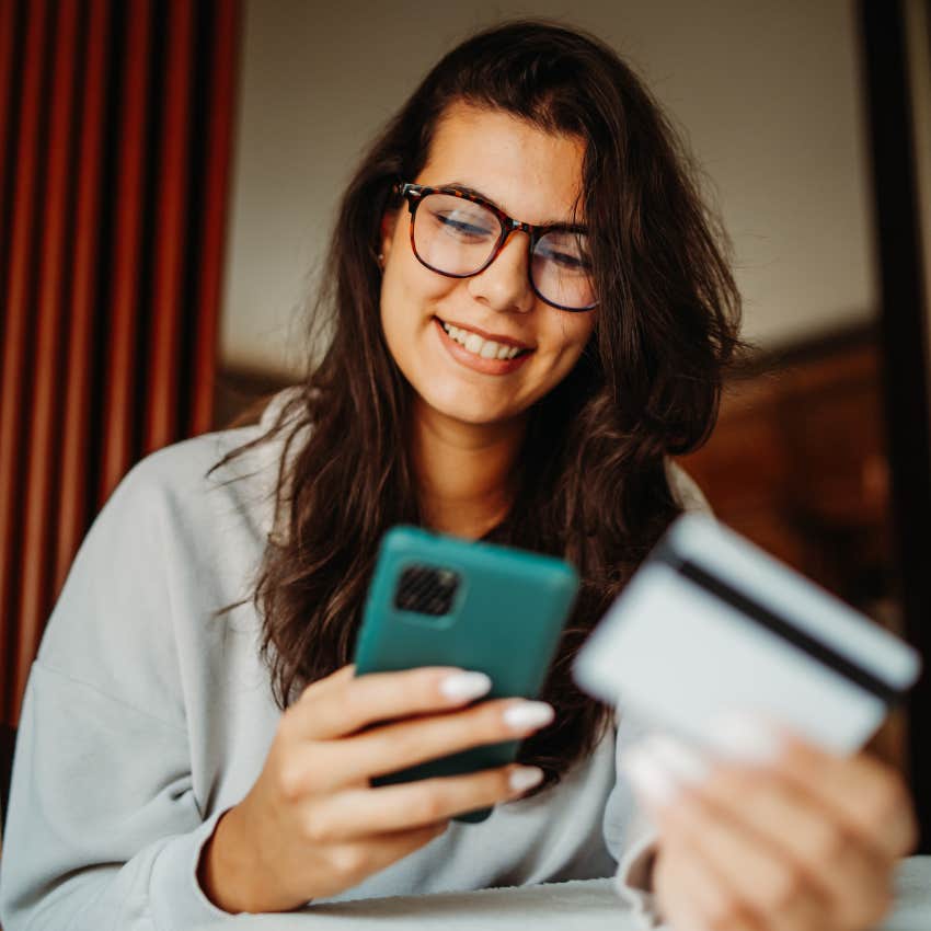 Woman who believes everything should be convenient shopping on her phone.