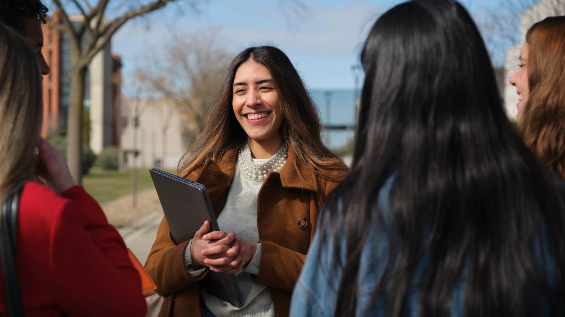 group of women chatting as multicultural environments has changed social norms