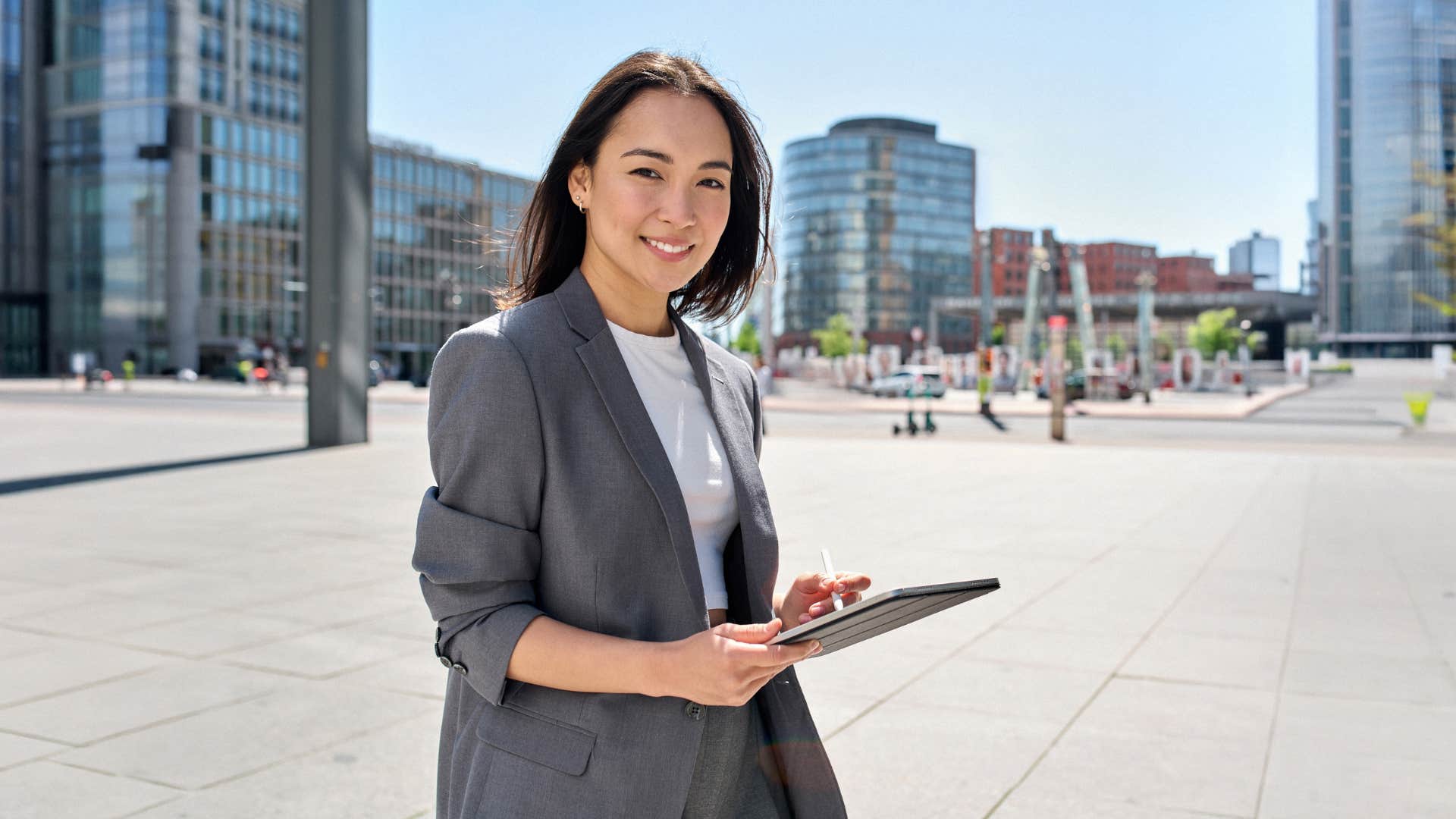 woman in suit smiling as the younger generations are highly individualistic
