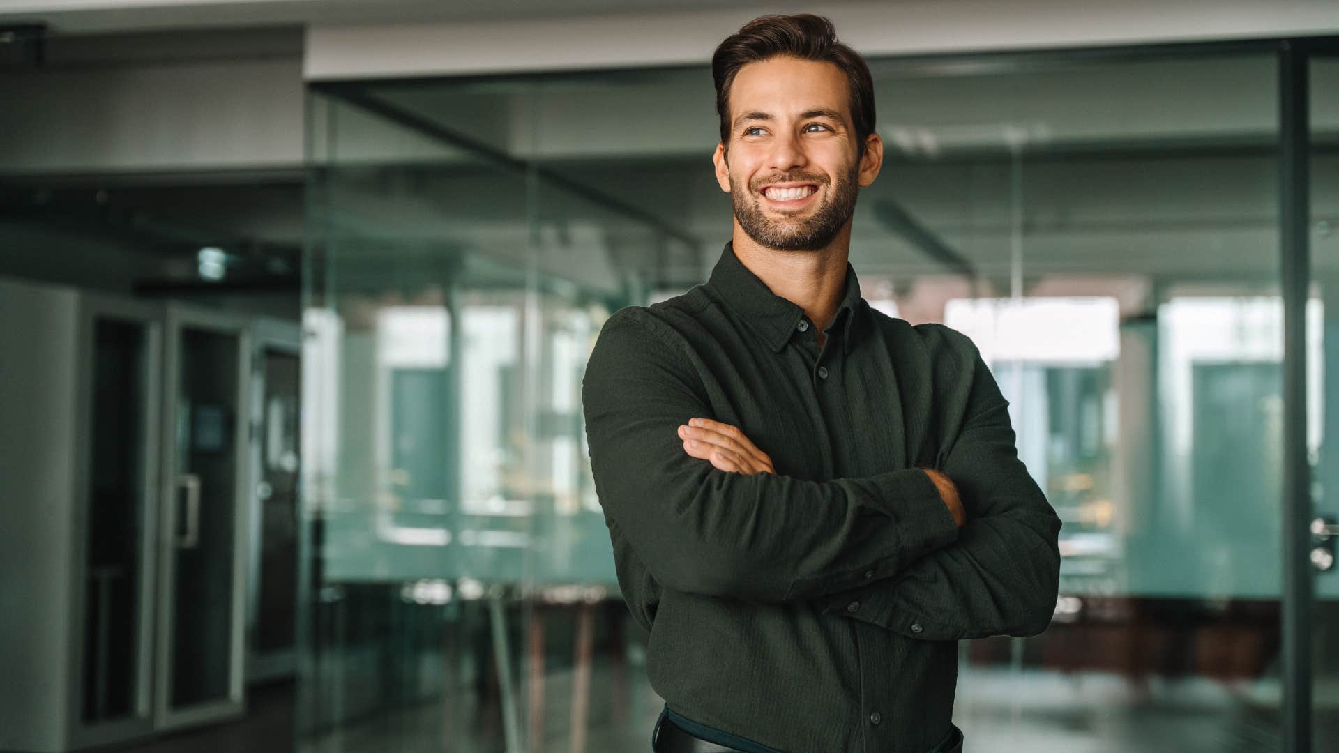 man in black shirt smiling as the younger generations express confidence differently