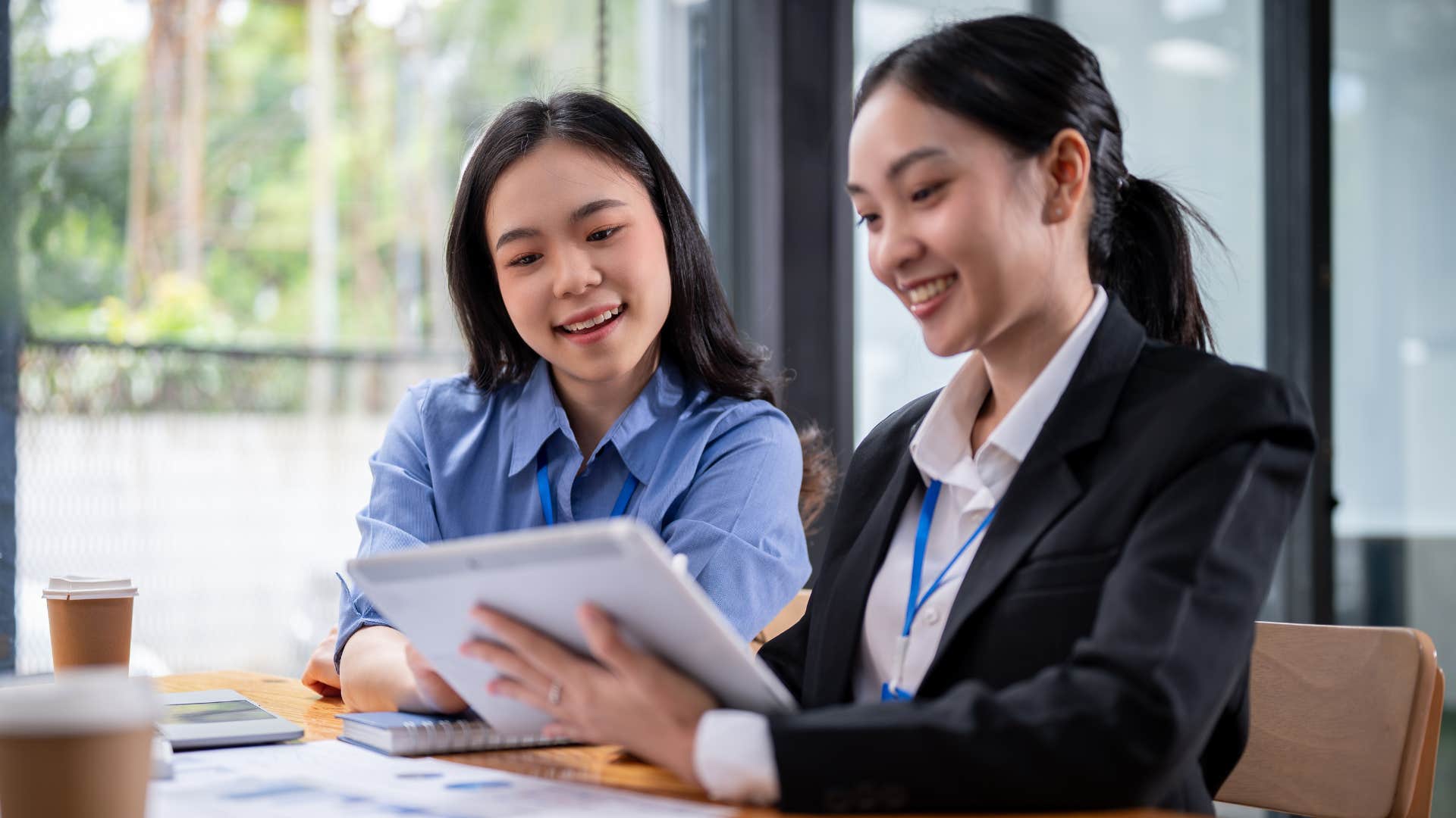 coworkers chatting and working together as the younger generations have replaced collaboration over hierarchy
