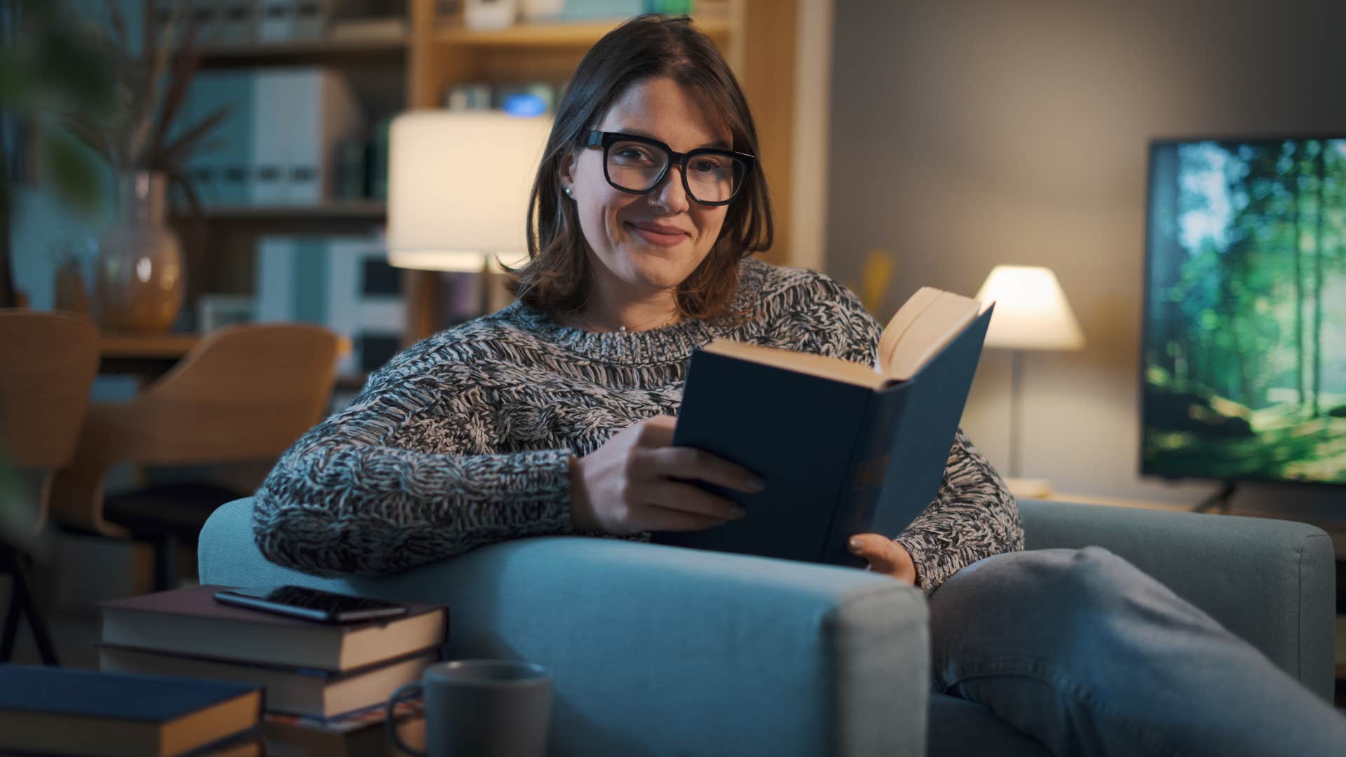 introverted woman reading book at home