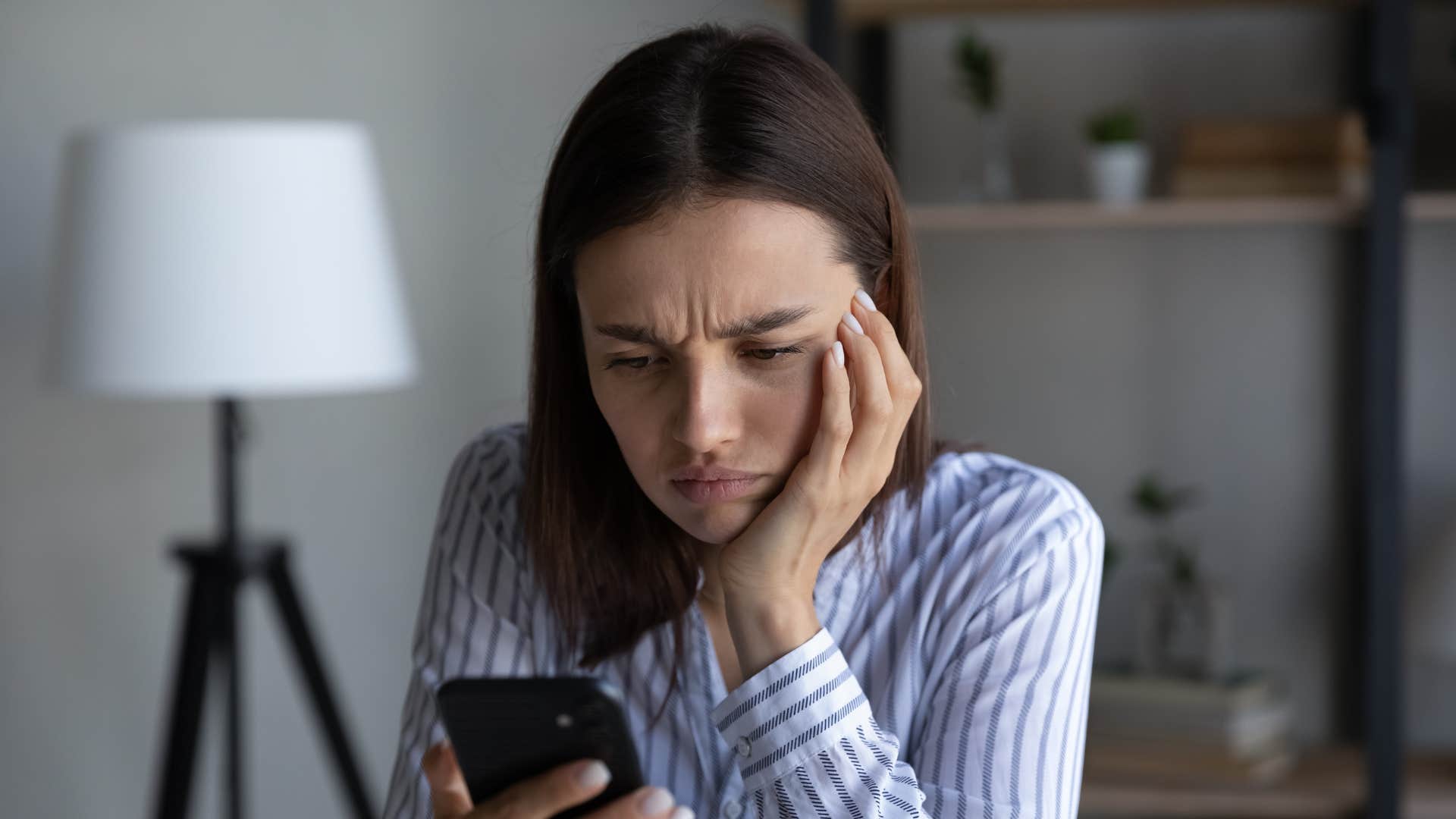 woman who dislikes drama texting on phone
