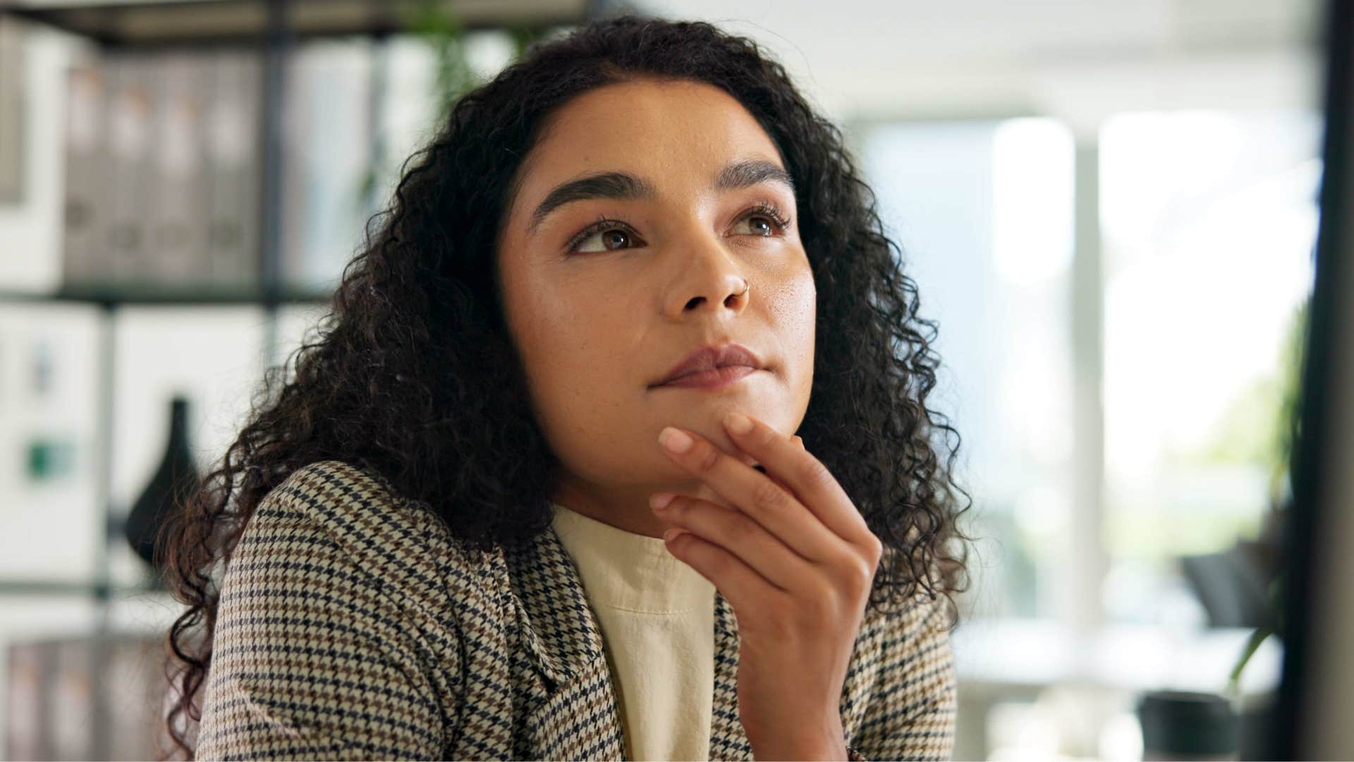 woman thinking deeply as they notice small inconsistencies