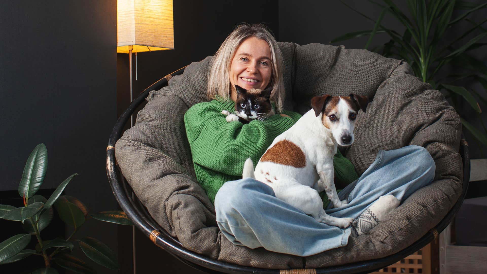 protective woman who hates most humans but loves animals laying on recliner with dog