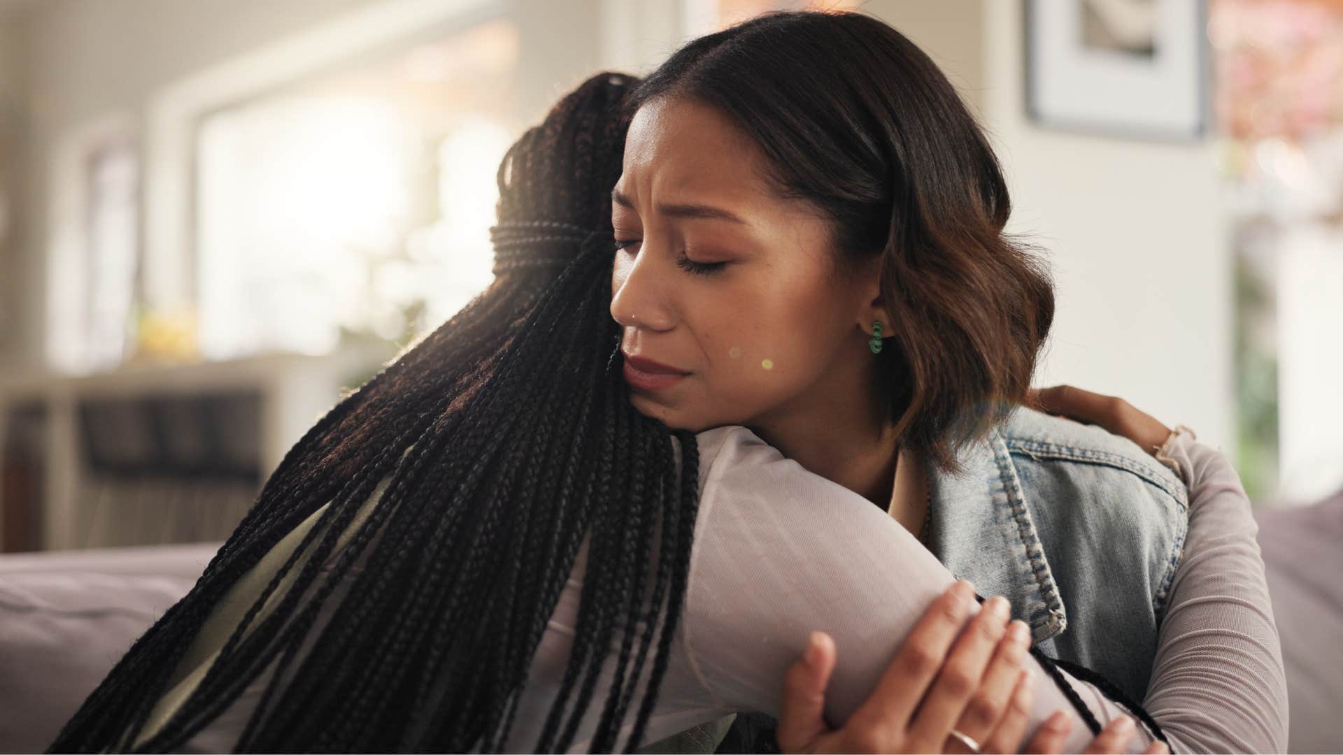 woman hugging friend as she has strong emotional intelligence