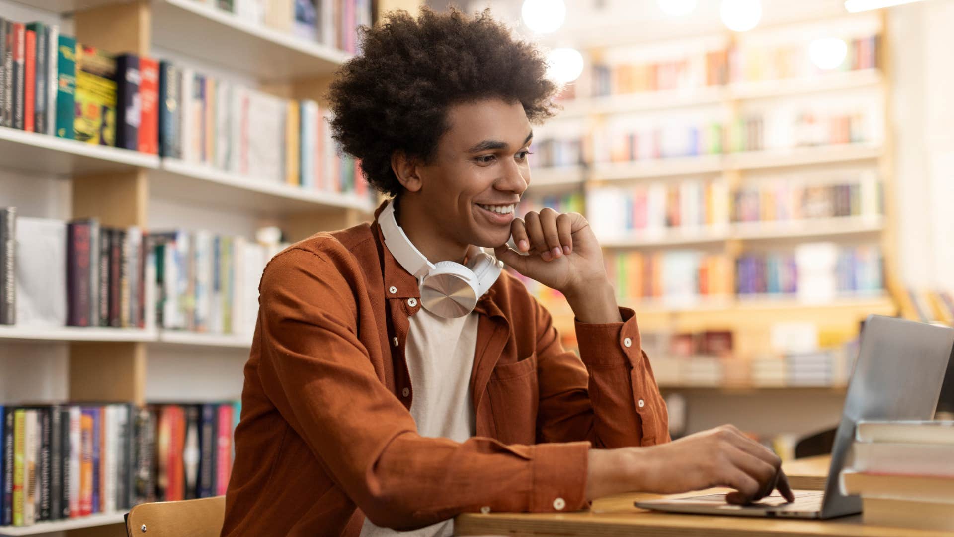 goal-oriented man studying hard at library 
