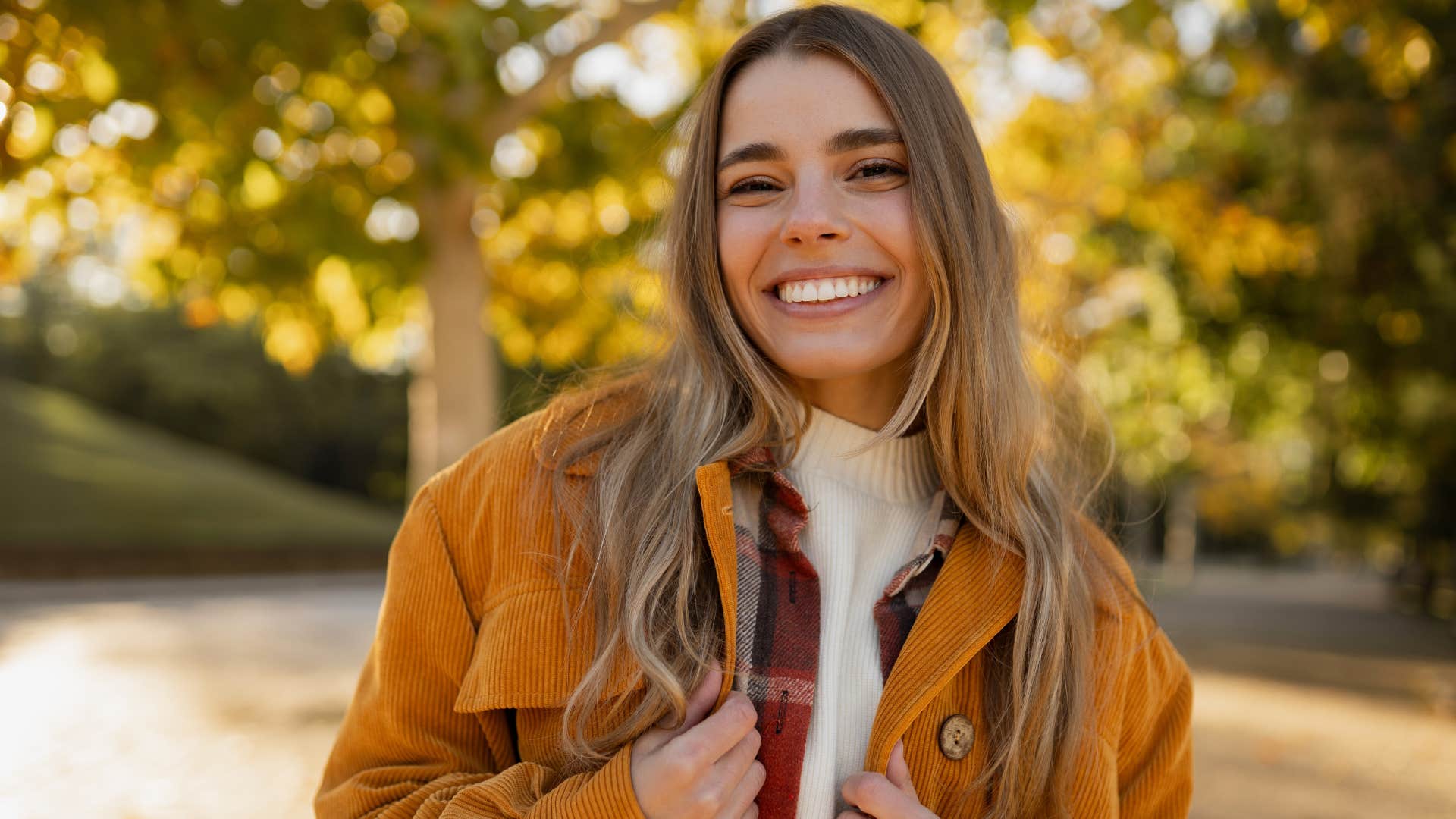 happy woman with a minimalist mindset standing outside