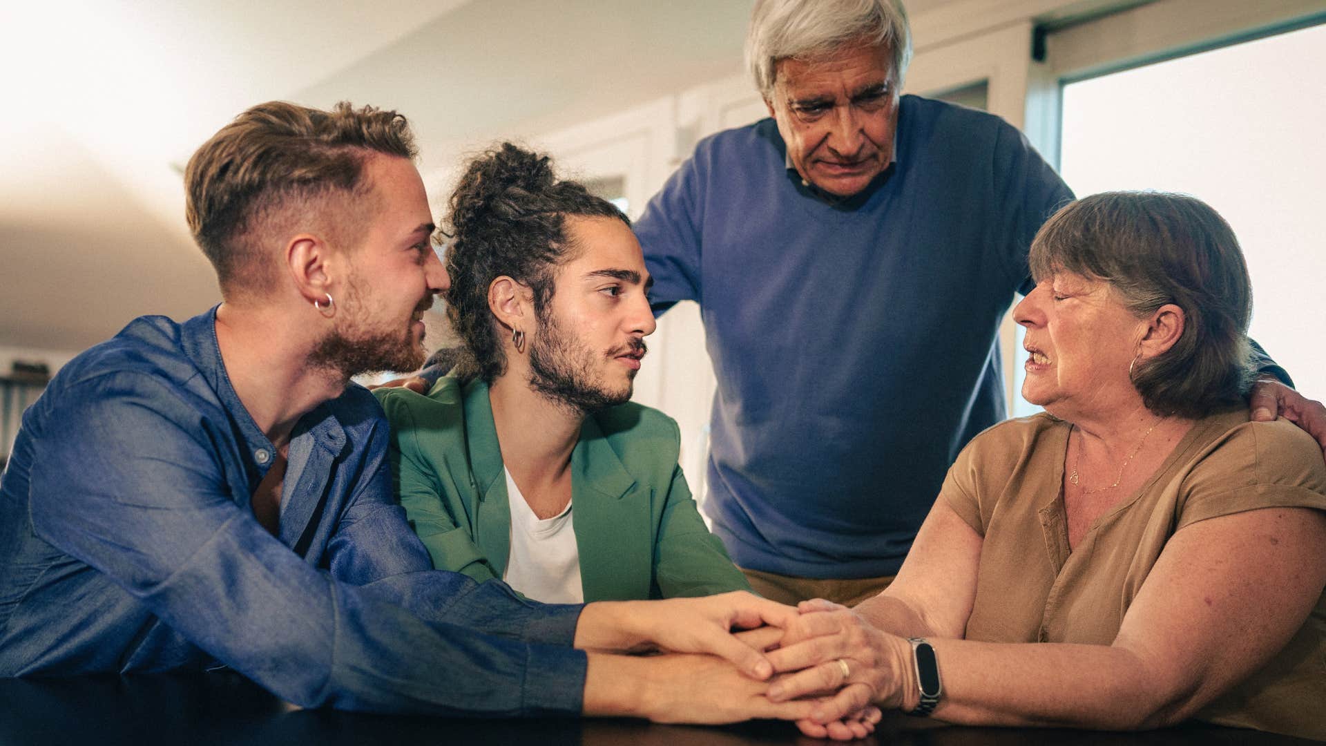 intergenerational group hold hands showing shared emotions are simple thing