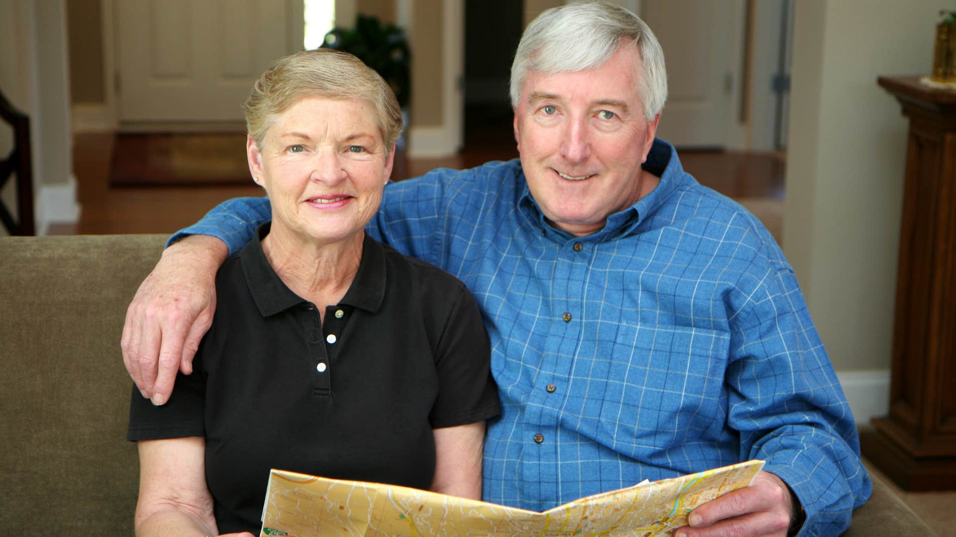 happy couple hold map showing result from work is simple thing