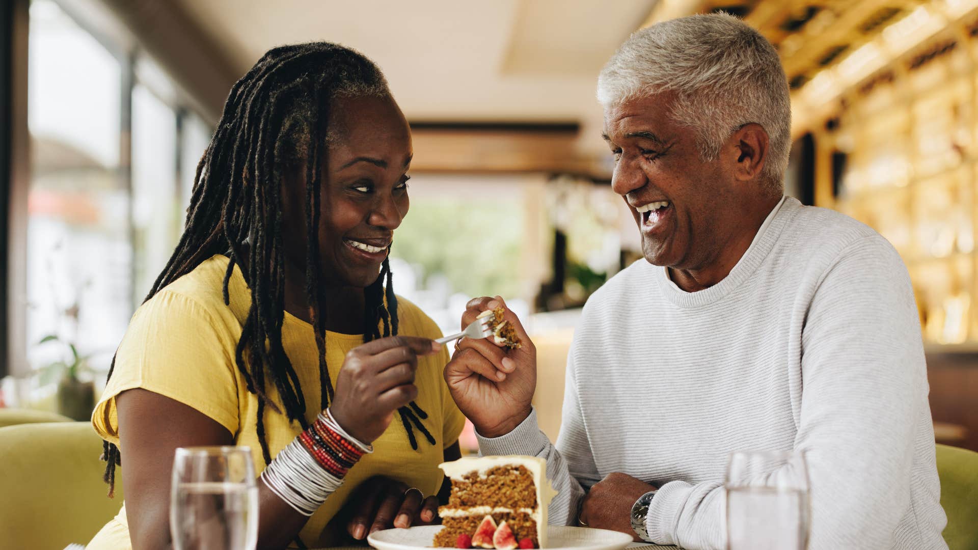 happy couple share cake showing good expectations