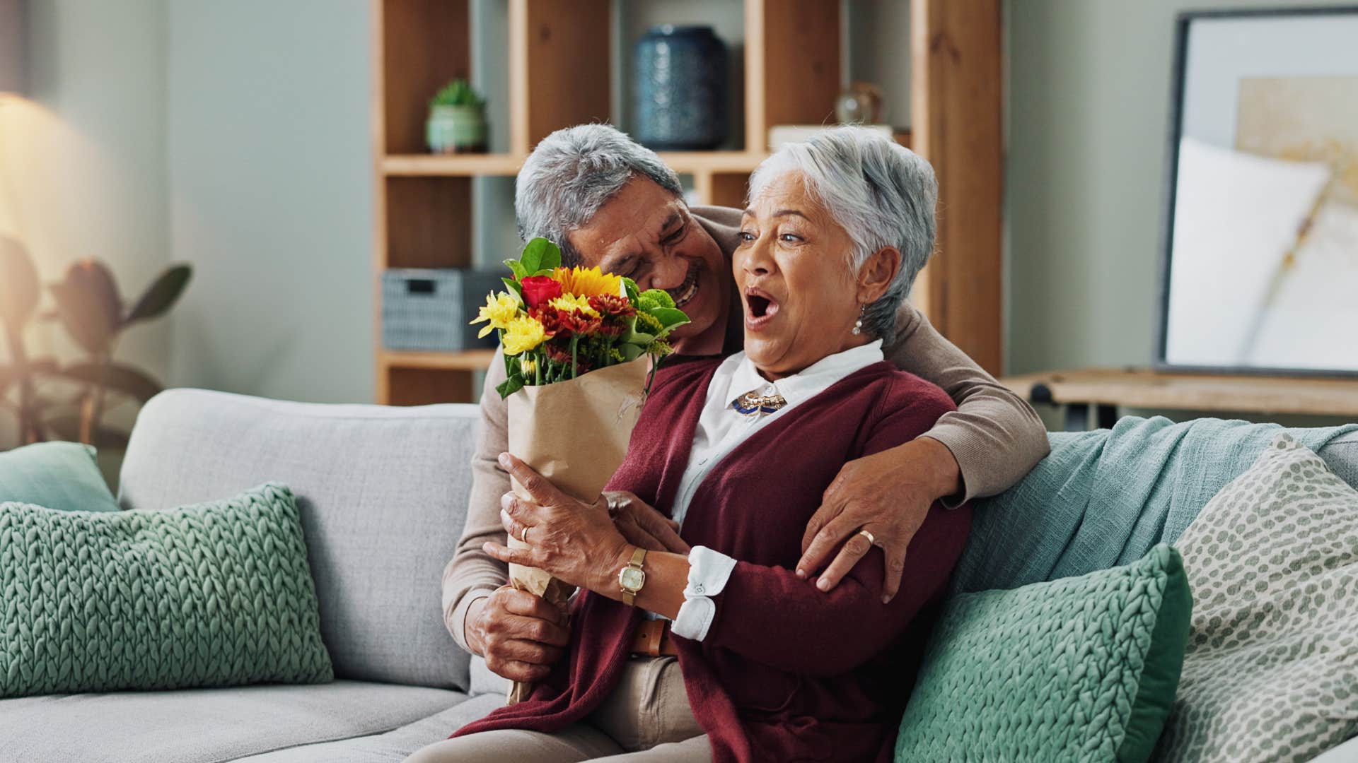 loving person surprises happy spouse showing what they would miss