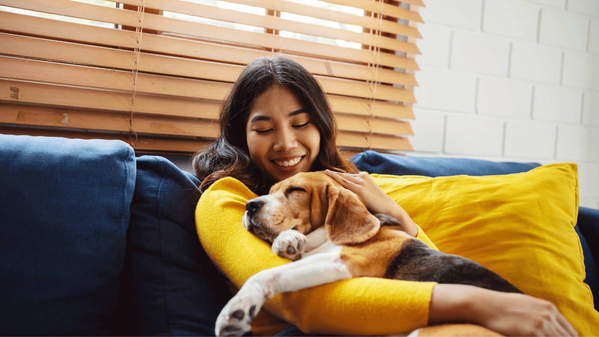 woman who sleeps with pet in her bed and is comfortable with pet hair