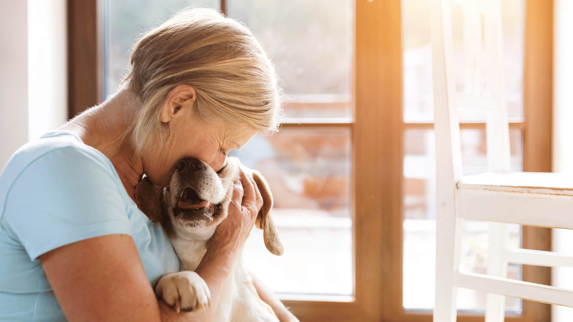 woman who sleeps with pet in her bed and enjoys the quiet companionship