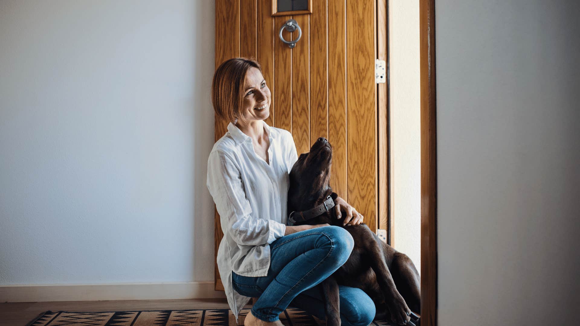 woman who sleeps with pet in her bed and treats the pet like an emotional support system
