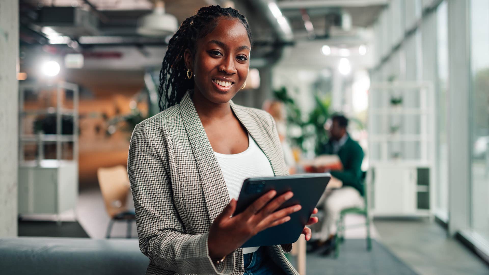 woman with tablet is independent as she works