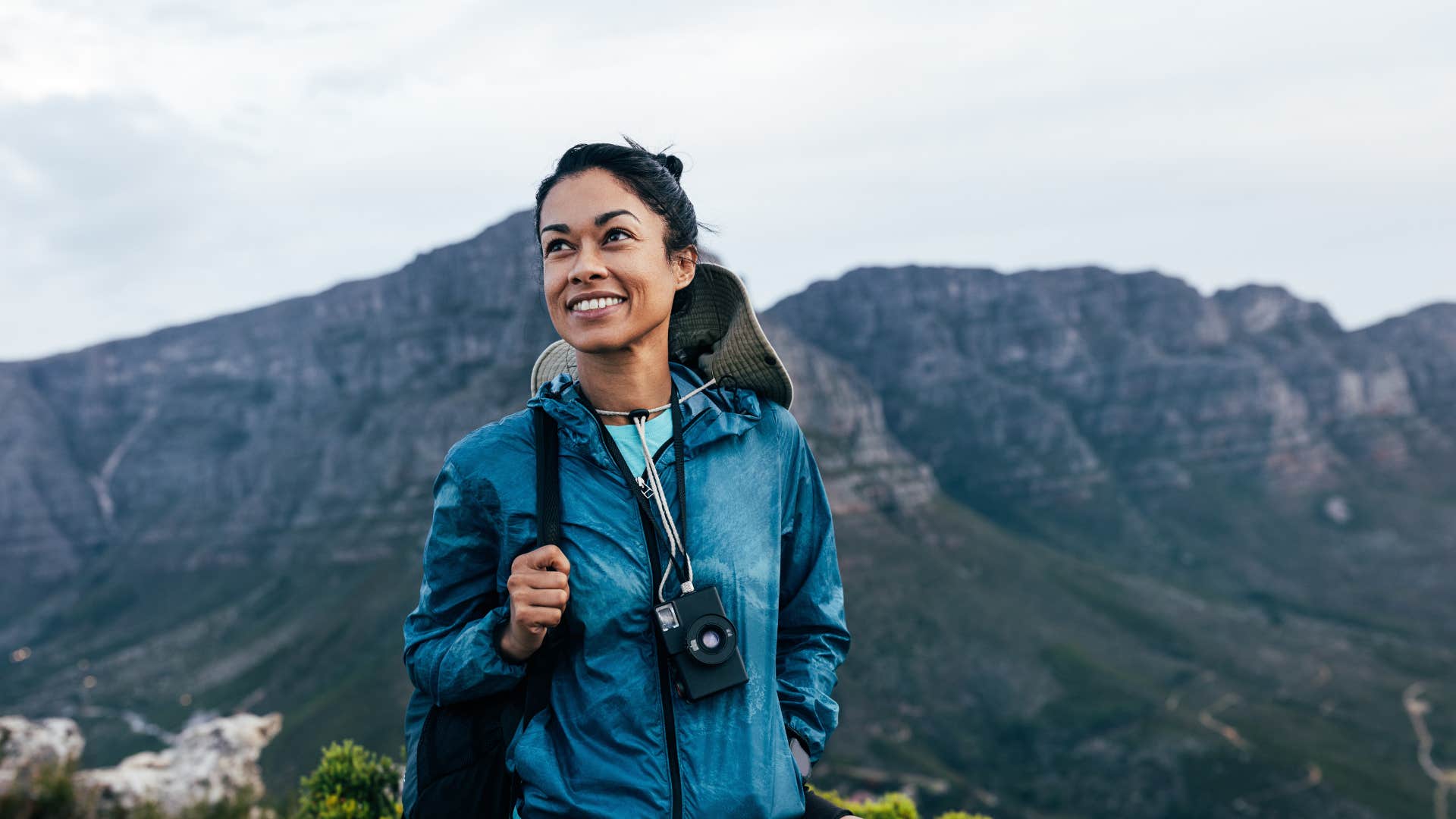 adventurous woman smiling on a hike