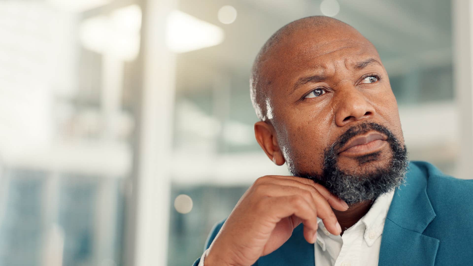 deeply curious businessman thinking in office