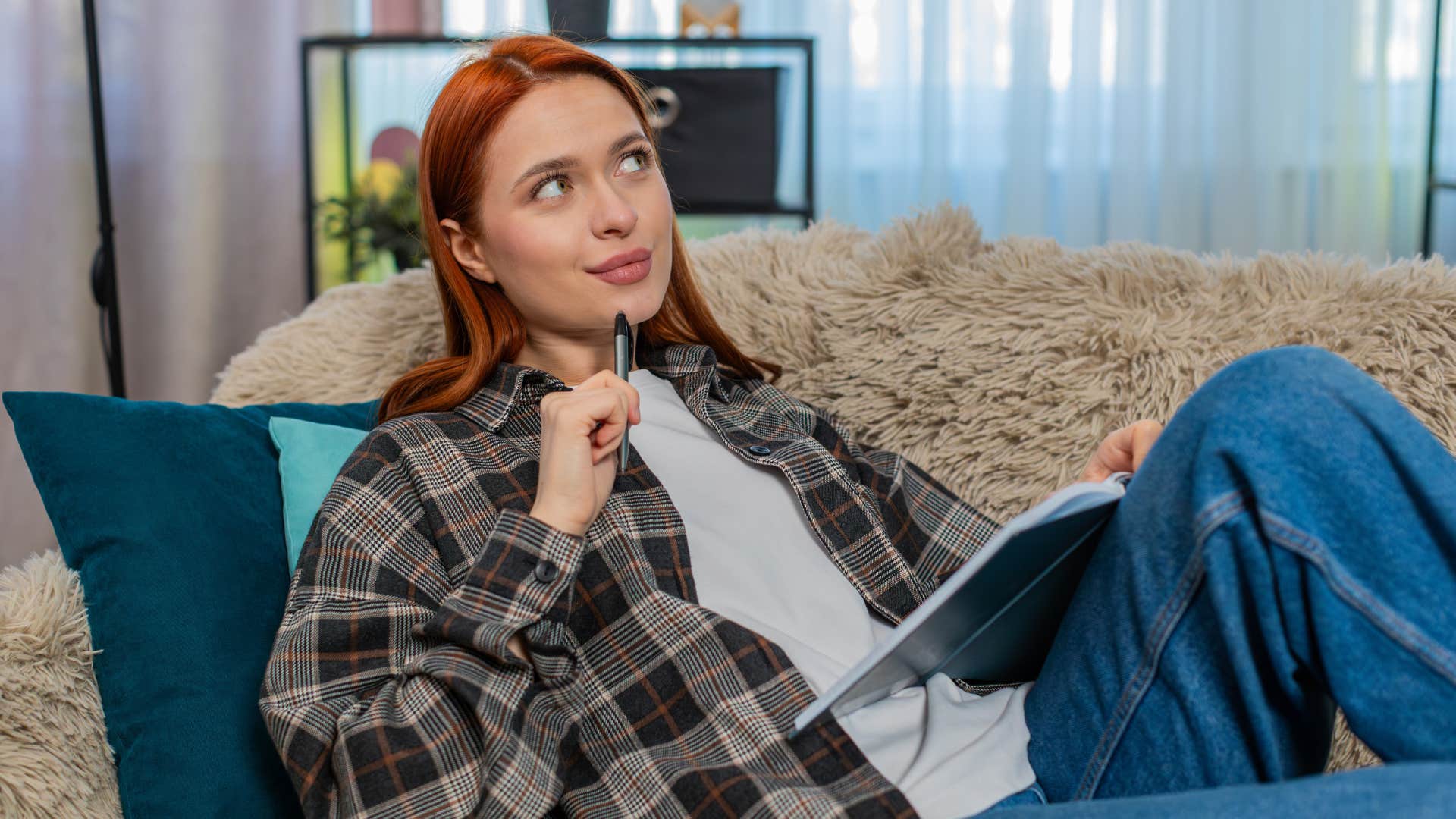 woman thinking while flexibly planning events in calendar