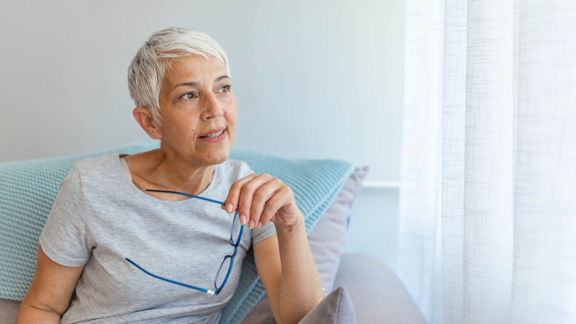self-reliant woman sitting at home thinking