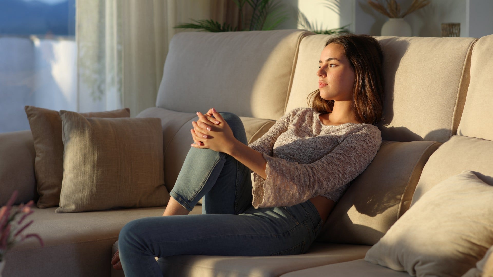 woman who almost always feels relief when plans get canceled because she is exhuasted