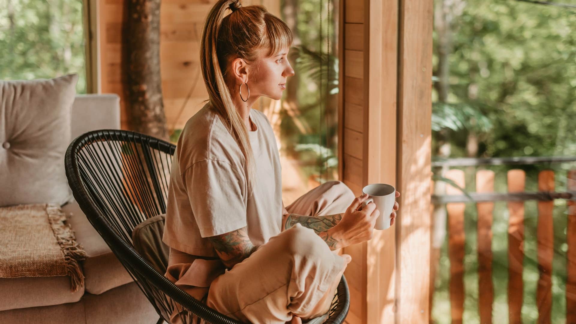 woman who craves comfort amid the chaos sitting cross legged