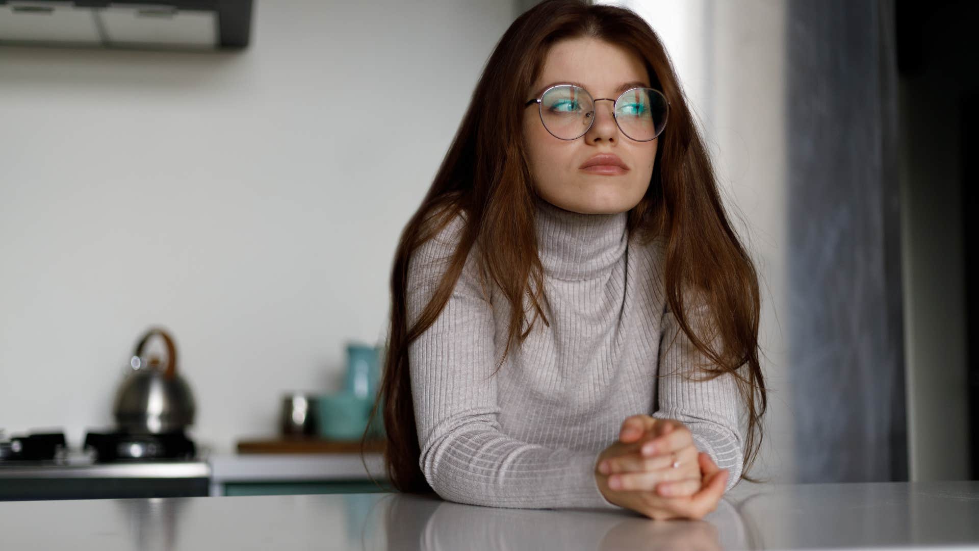 conscientious woman being pensive at home