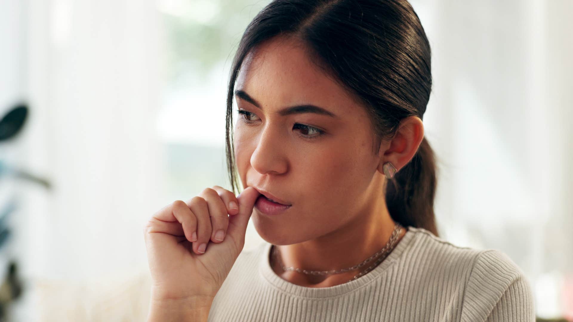 curious woman who can't stop herself from watching all of the news