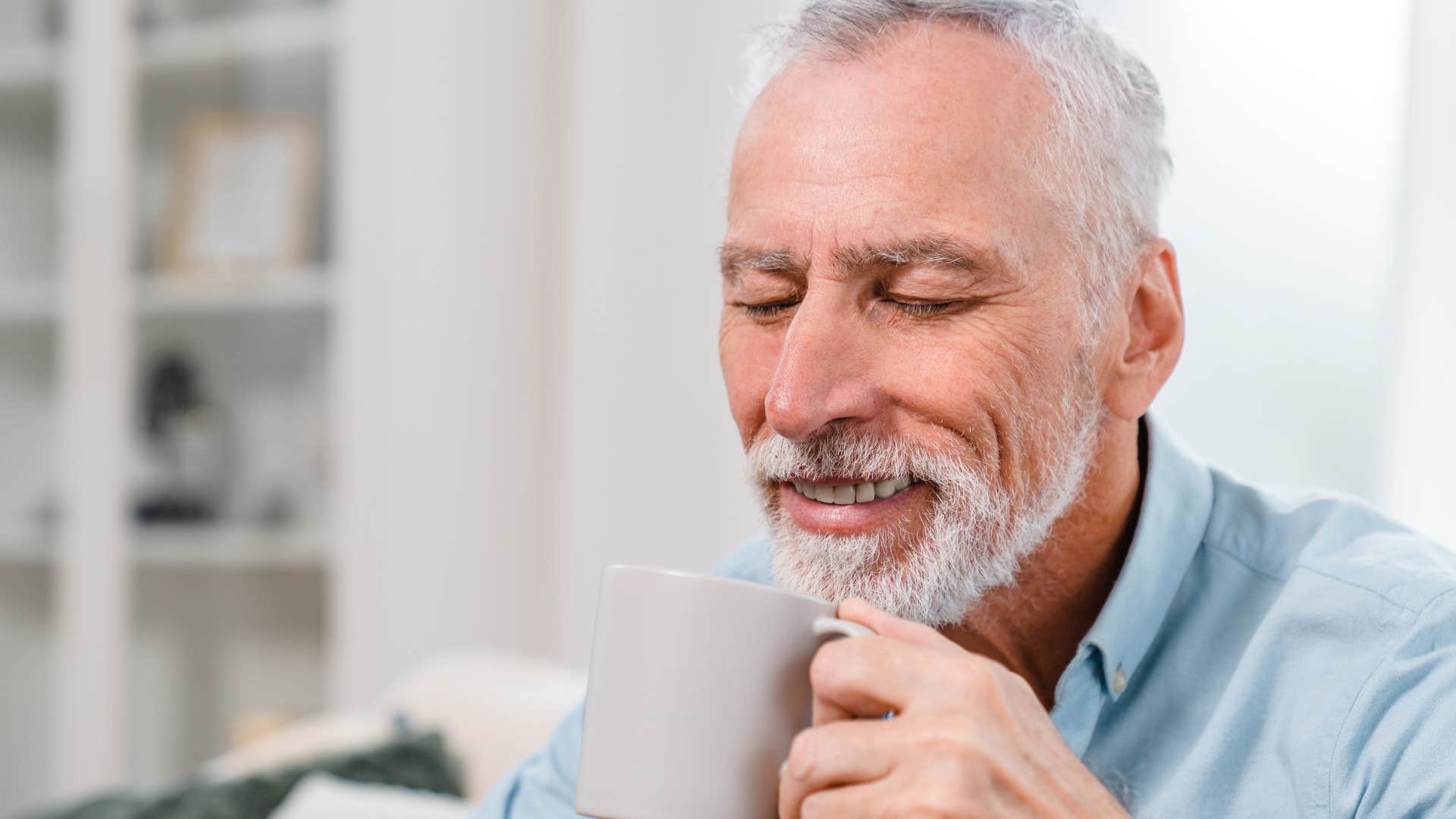 Man who appreciates his alone time drinking coffee at home.