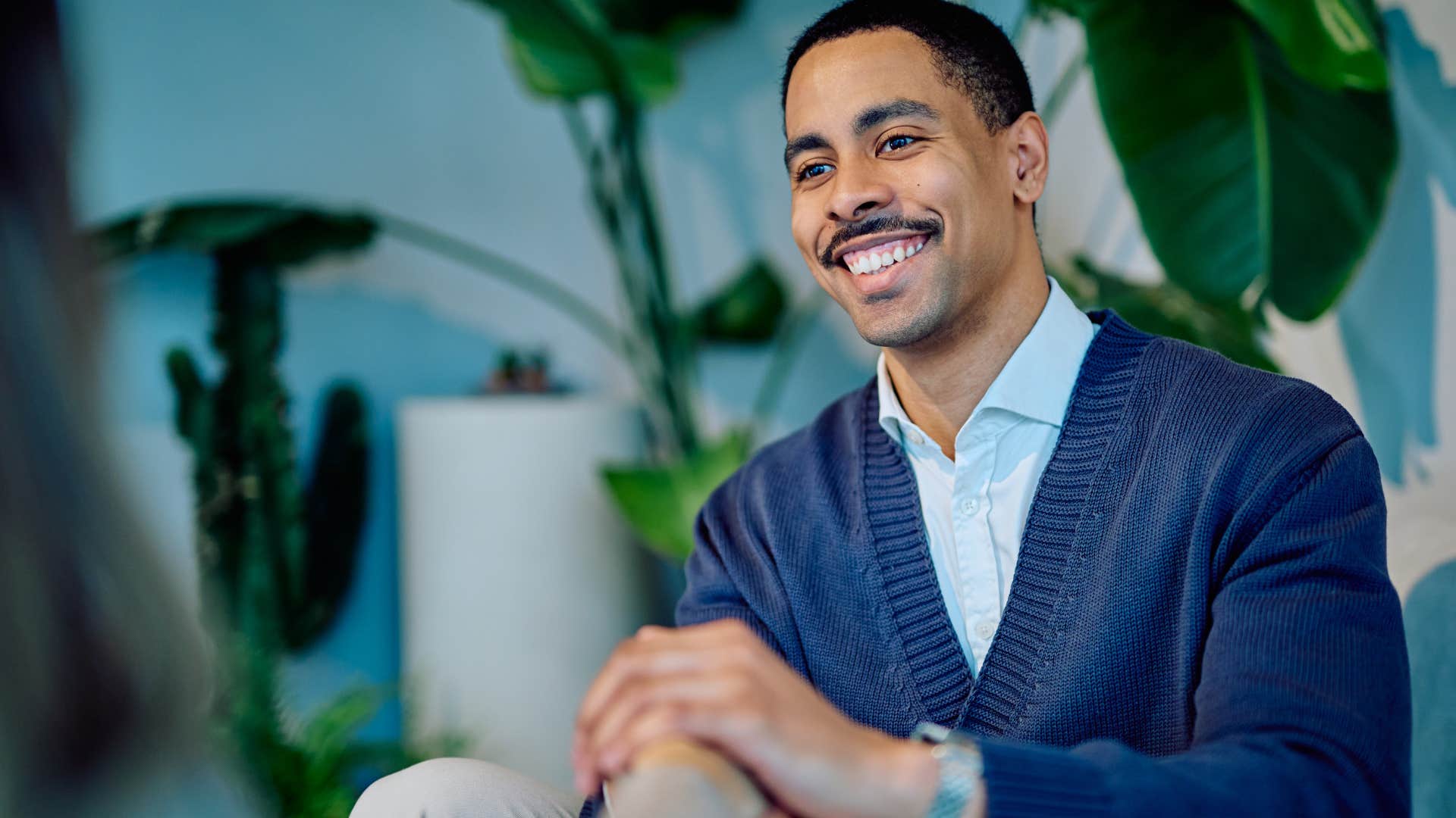 socially awkward man who doesn't interrupt people sitting at home