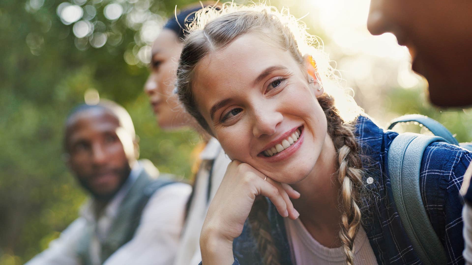 woman who's less judgmental than others smiling at friends