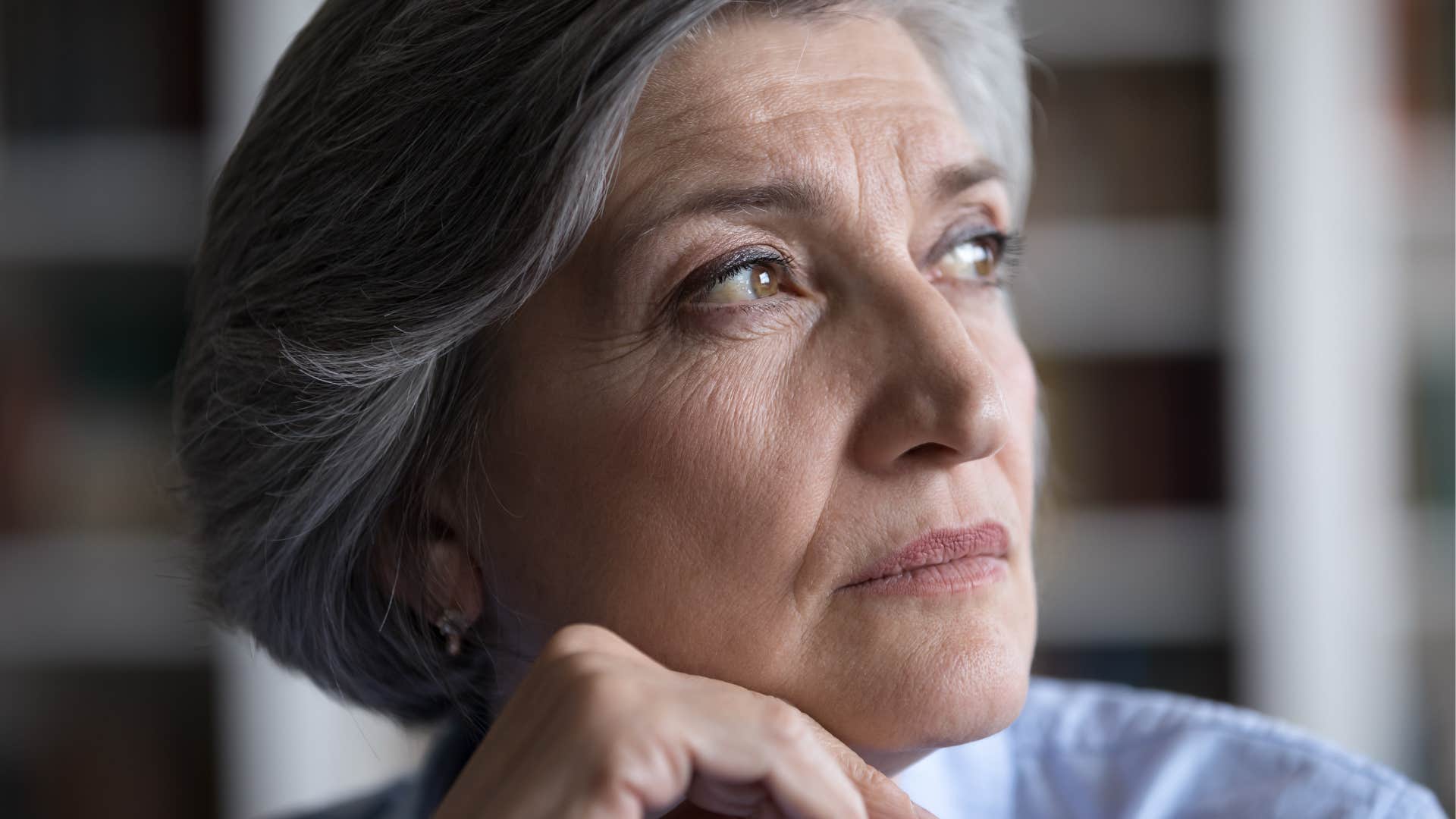 Serious person reflects on job loss