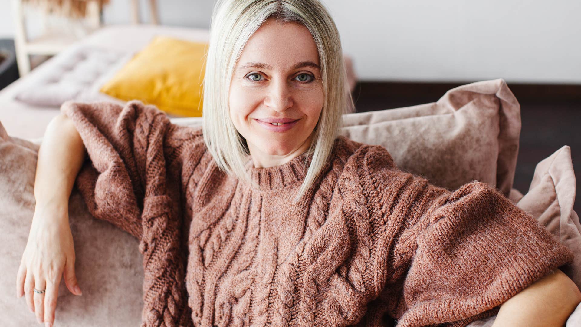 happy woman who can't seem to hate anyone not taking anything personally