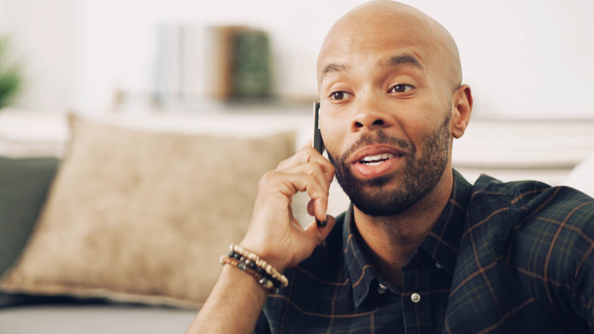 Man saying "I'm going to stay home tonight" on the phone.