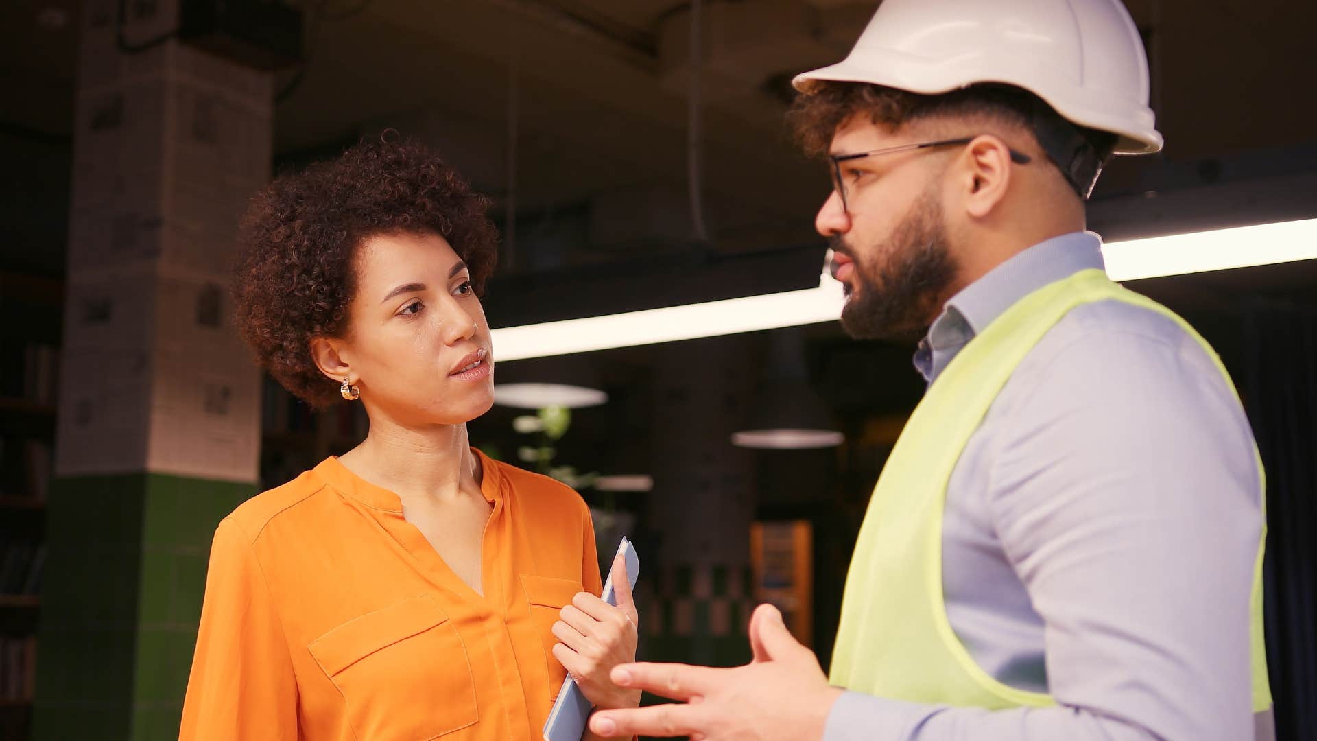 Woman saying "that doesn't make sense to me" to a co-worker.