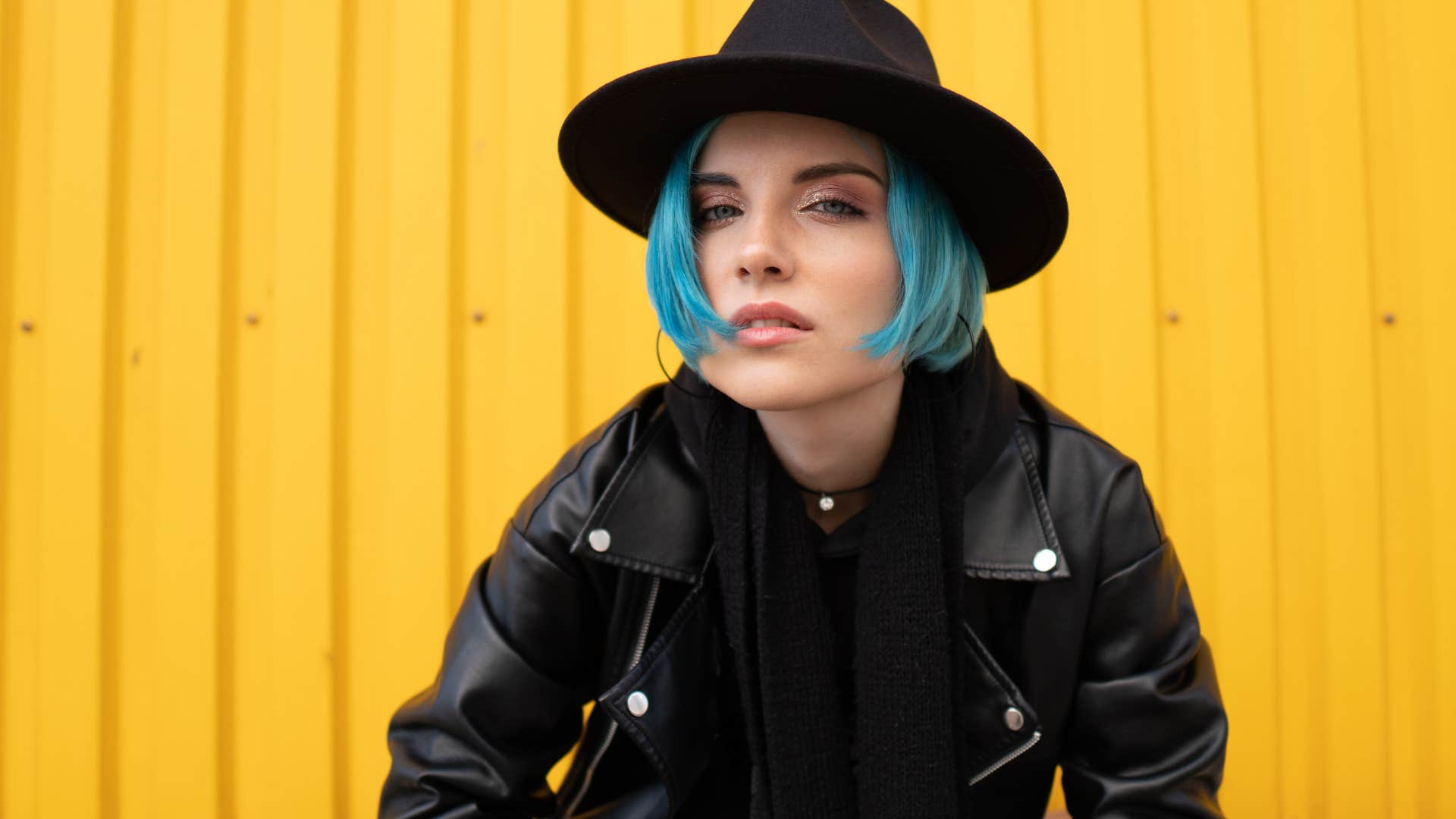 confident woman with blue hair