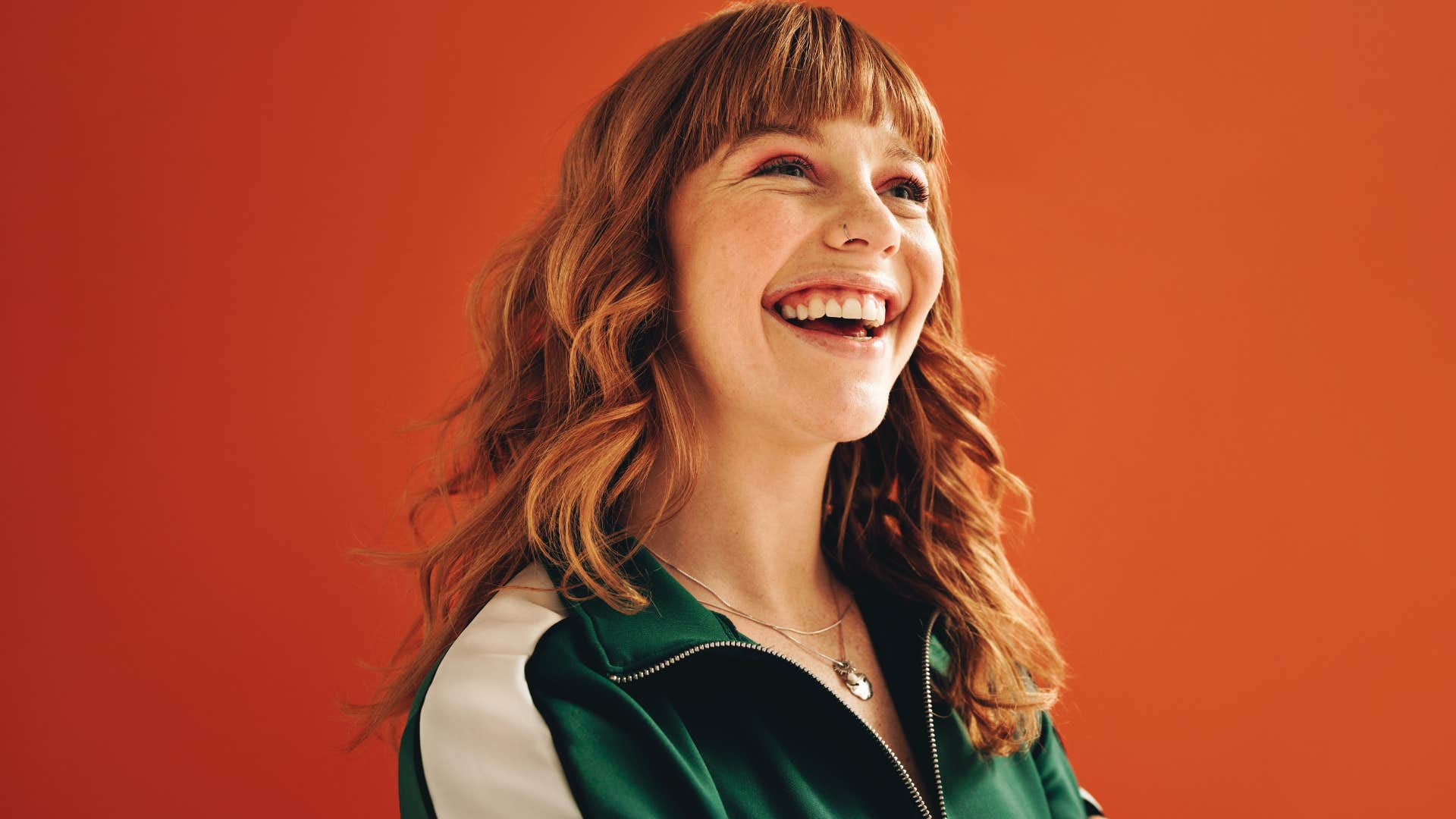 playful woman with dyed hair smiling