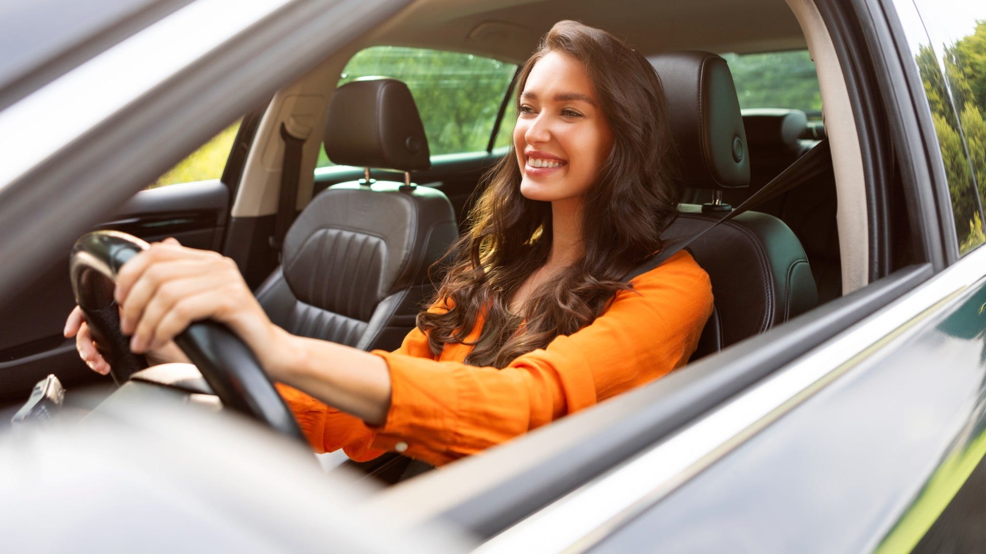 woman who enjoys drives with no destination as she appreciates small moments of freedom