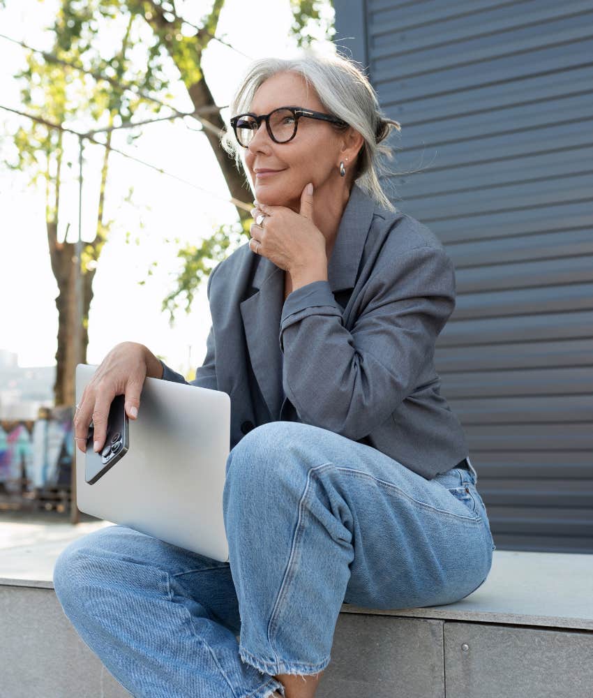 Older person with laptop thinks clearly showing path to fulfilling work