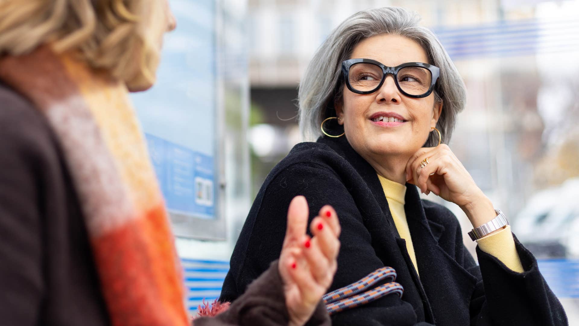 woman who doesn't mind being misunderstood having a conversation outside