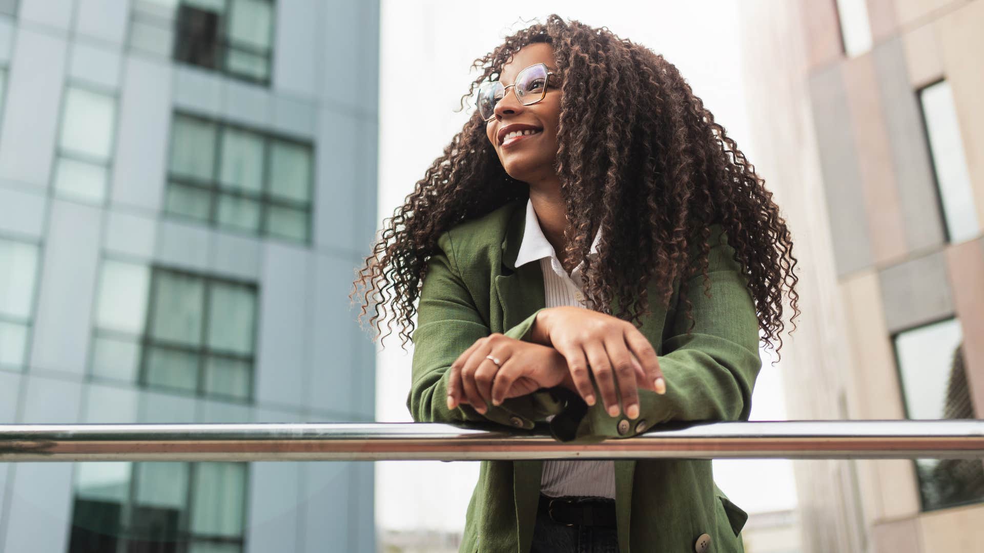 incredibly independent woman smiling alone on work break