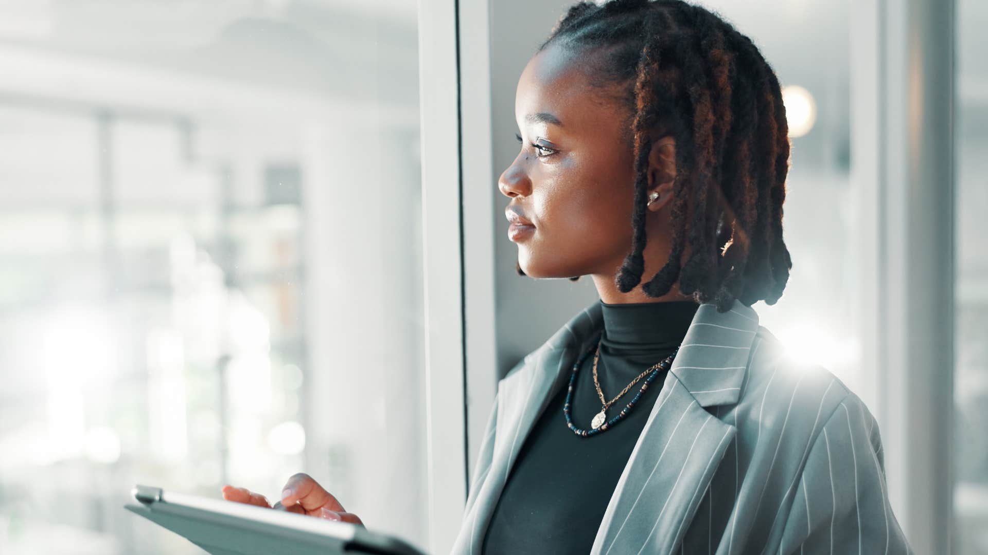 easily bored woman who notices everything looking around at work