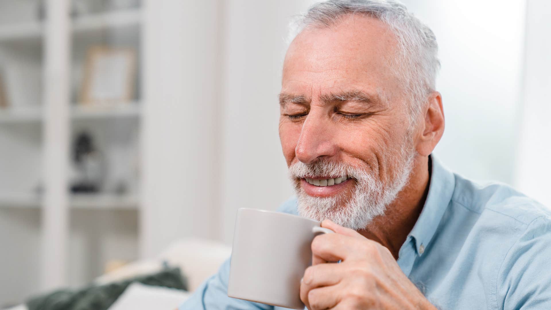 bored man who values his alone time drinking coffee at home