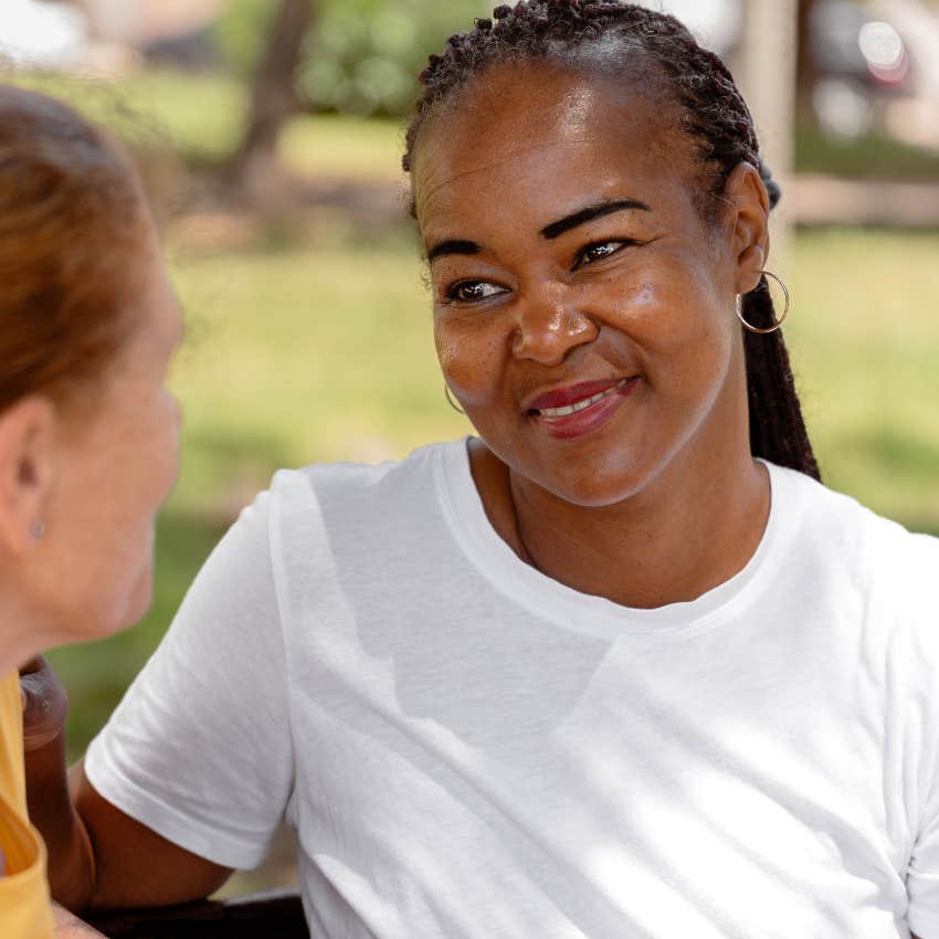 woman who doesn't mind being misunderstood smiling at acquaintance